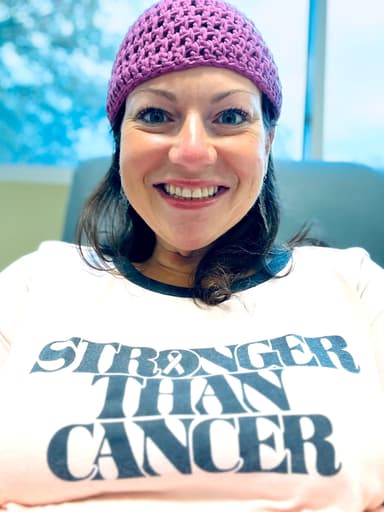 Julie Stevens, Founder and CEO of Vedalife, wearing a 'Stronger Than Cancer' shirt